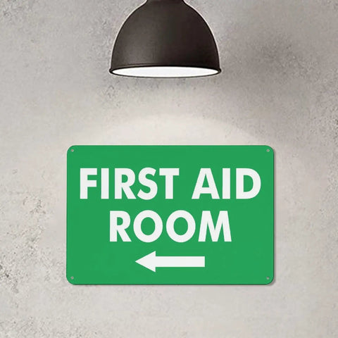 Left Arrow First Aid Room Outdoor Medical Safety Sign 8x12 Aluminum under lamp on wall