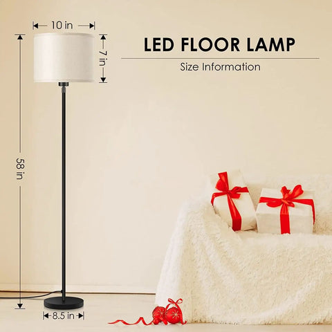 58 Inch Floor Lamp Standing Bright Light With Beige Lampshade And Easy On Off Foot Pedal Simple Pole Style For Living Room Corners Kid Friendly 6Lb Stable Base Great For Bedroom Or Office Decor Bulbs Not Included beside a sofa with gifts