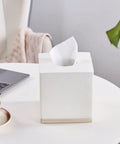 Hand Carved Beige Leather Cube Tissue Box Holder With Square Resin Cover on office desk with coffee and laptop