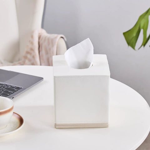 Hand Carved Beige Leather Cube Tissue Box Holder With Square Resin Cover on office desk with coffee and laptop