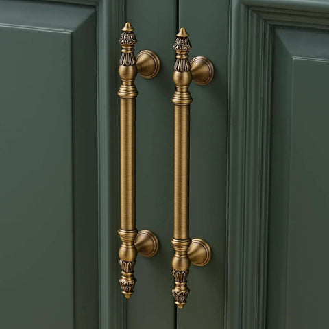 Twenty Pack Solid Brass Cabinet Pulls With Brushed Antique Brass Finish Six And Five Sixteenth Inch Hole Center handles on green cabinet