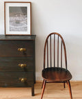 Dark wooden dresser with Retro Antique Brass Zinc Alloy Cabinet Knob With Backplate beside a wooden chair and framed artwork