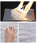 Tough As Nails Waterproof Roof Repair Tape application with roller and fire demonstration on bitumen sealing roll.
