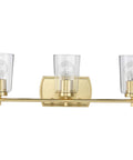 Adley Collection 3 Light Clear Glass Bath Vanity Light In Satin Brass, sleek bar fixture with crystal clear glass shades