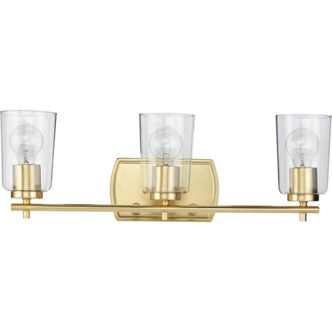 Adley Collection 3 Light Clear Glass Bath Vanity Light In Satin Brass, sleek bar fixture with crystal clear glass shades