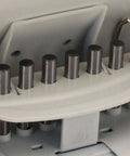 Close-up of Heavy Duty Metal Hole Punch For Home Office Desk showing 10 punch mechanism, handheld desktop paper punch in white.