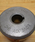 Top view of L-1501.125 Jaw Coupling with 1.125 inch bore and 3.75 inch outer diameter on wooden surface.