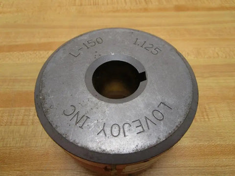 Top view of L-1501.125 Jaw Coupling with 1.125 inch bore and 3.75 inch outer diameter on wooden surface.