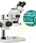 Trinocular Stereo Zoom Microscope With 56 Bulb LED Ring Light 3.5X To 90X Magnification WF10X Eyepieces 0.7X To 4.5X Zoom Objective 0.5X And 2.0X Additional Objectives Table Pillar Stand Pro Grade Lab Gear For Researchers And Gemologists on pillar stand, with PCB viewed under LED light
