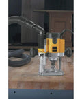 Pro Grade Workhorse Two Horsepower Plunge Router With Slick Ten Amp Electronic Variable Speed Motor on workbench.