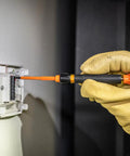 Using the 8-In-1 Insulated Screwdriver Set with 1000V rating on electrical panel, demonstrating Phillips blade in action.