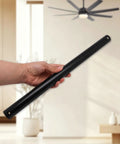 Hella Sturdy 16 Inch Ceiling Fan Extension Rod Non Threaded Drop Pipe shown in hand, matte black metal design for stability.