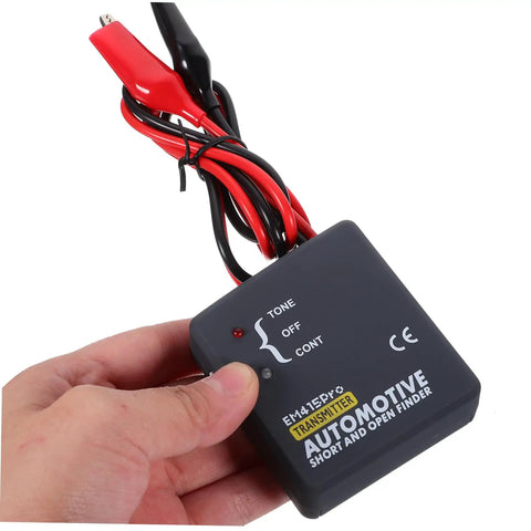 Hand holding automotive short and open finder with connectors for Must Have Multi Functional Car Short Circuit Tester And Wire Breaker Tracker Kit For DIY Auto Enthusiasts And Pros Built With ABS Plastic And Electronic Components For Real Reliable Performance.