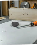 Chill Out With These 6 Pack Nylon Buffing Discs That Make Furniture And Cars Shine Like New While Keeping Things Smooth, Gentle, And Super Safe For Delicate Surfaces Without Scratching Or Messy Cleanup On The Job, showing a dark grey nylon disc beside a screwdriver on a workbench.