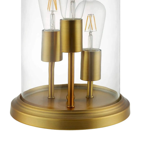 Close-up of Vintage Brass Glass Cloche End Table Lamp With Industrial Modern Vibe, highlighting brass base and three sockets.