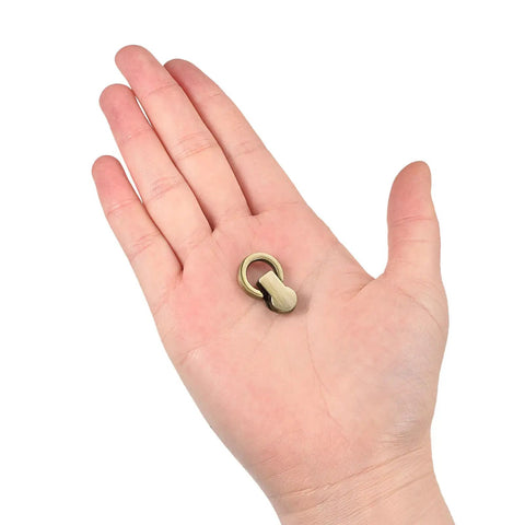 Rock Solid Ball Stud Rivet Kit Four Pieces With Attached D Rings And Swivel Hooks For Leather Crafts Purse Chains And Diy Repairs Bronze Zinc Alloy Hardware straight fire held in hand.