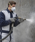 Person wearing Heavy Duty Leather Blast Suit For Spray Painting And Sandblasting, Protective Denim And Leather Overalls with reinforced panels