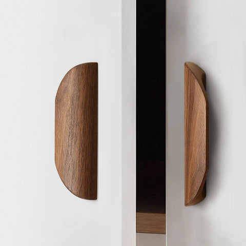 Oak Wood Oblique Angle 4.41 Inch Windbreaker Cabinet Door Handle In Antique Long Walnut Finish on white cabinet, side view