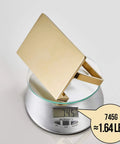 Solid Brass Toilet Paper Holder With Gold Finish, Hotel Style Tissue Roll Holder Plus Built In Cell Phone Shelf on scale showing 745g