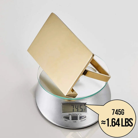 Solid Brass Toilet Paper Holder With Gold Finish, Hotel Style Tissue Roll Holder Plus Built In Cell Phone Shelf on scale showing 745g