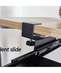 Slick Glide Under Desk Keyboard Tray With Smooth Pull Out Drawer Holds Mouse And Keyboard Ergonomic Sliding Extender close-up of steel bracket and glide rail.
