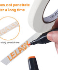 Half Inch Masking Tape 60 Yards Per Roll 12 Rolls White No Residue Painters Tape shown with marker writing on tape.