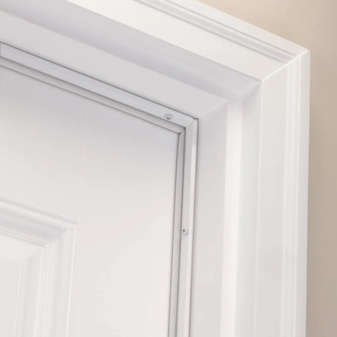 White Aluminum And Vinyl Door Seal Kit With Screw On Top And Sides Blocks Drafts Moisture Dust And Insects Includes One 36 Inch L Strip And Two 84 Inch L Strips For Exterior And Interior Doors installed on a door frame