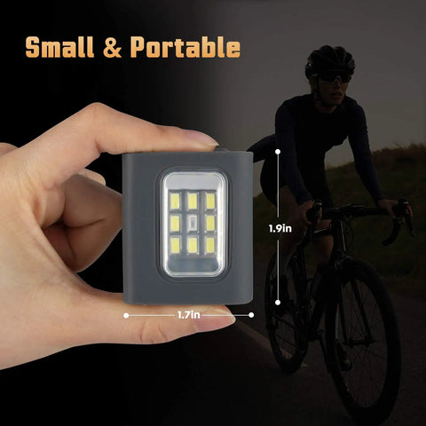Close-up of a Clip On LED Running Lights 2 Pack USB Rechargeable Reflective Night Jogger Gear next to a cyclist at dusk.