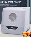 Real Deal Portable Countertop Dishwasher With Foolproof Leak Seal For Dorms Apartments RV Offices Generous Tub shown with digital controls and fruit.