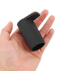 Hand holding a black rubber cap from 8 Pack Keyboard Stand Feet Replacement Caps For Digital Pianos And Keyboards Shock Absorbing Non Marking Leg Protectors For Home Studio Easy Install And Secure No Slip.