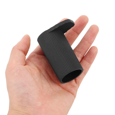 Hand holding a black rubber cap from 8 Pack Keyboard Stand Feet Replacement Caps For Digital Pianos And Keyboards Shock Absorbing Non Marking Leg Protectors For Home Studio Easy Install And Secure No Slip.
