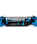 Carbon Fiber and Metal RC Chassis Frame for TT02 1/10 Scale with blue metal accents and rugged structure, side view