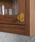 Close-up of Antique Brass Cabinet Knobs With Backplate 6 Pack Solid Zinc Alloy single hole on wooden cabinet.