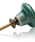 Slick Green Ceramic Cabinet Knobs 12 Piece Set with a smooth green knob and metal screw for retro furniture upgrades.