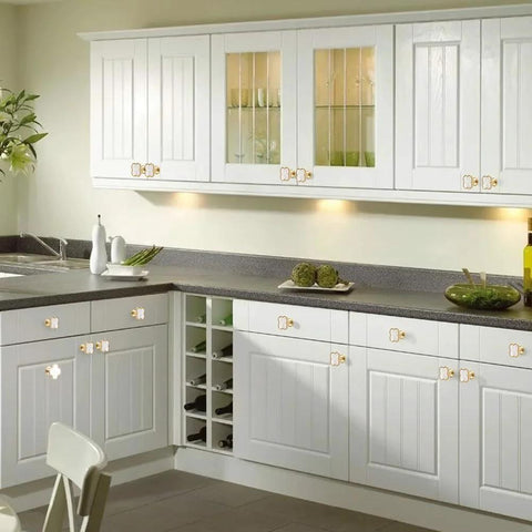 White kitchen cabinets with Four Leaf Clover Cabinet Knob Set 15 Pcs Zinc Alloy Pulls Gold Finish Clover Handles installed.