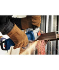 User grip on Street Tough 4.5 Inch Angle Grinder Featuring X Lock Tool Free Disc Swap Mount, cutting metal with sparks.
