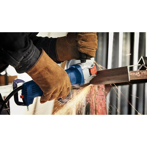User grip on Street Tough 4.5 Inch Angle Grinder Featuring X Lock Tool Free Disc Swap Mount, cutting metal with sparks.
