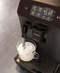 Top Shelf Automatic Espresso Brewer With Sturdy Built In Bean Mill And Silky Milk Frother For Killer Morning Brews No Hassle Auto Clean Features Plus Bold Flavor Dials For Real Coffee Heads Everyday with milk frother in use.