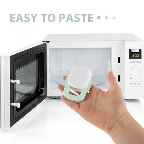 Hand holding light green safety lock in front of open microwave, Sturdy 4 Pack Oven Door Locks For Cabinets And Appliances, Kid Safe Kitchen Safety Locks, Easy Install, Light Green, Prevents Oven Access And Child Tampering, Peace Of Mind For Busy Homes.