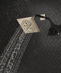 Square Shower Head With H2Okinetic PowerDrench Spray Kickin 3x Coverage 5 Spray Settings Touch Clean 1.75 GPM Lumicoat Polished Nickel Finish Full Body Spray emitting water in bathroom