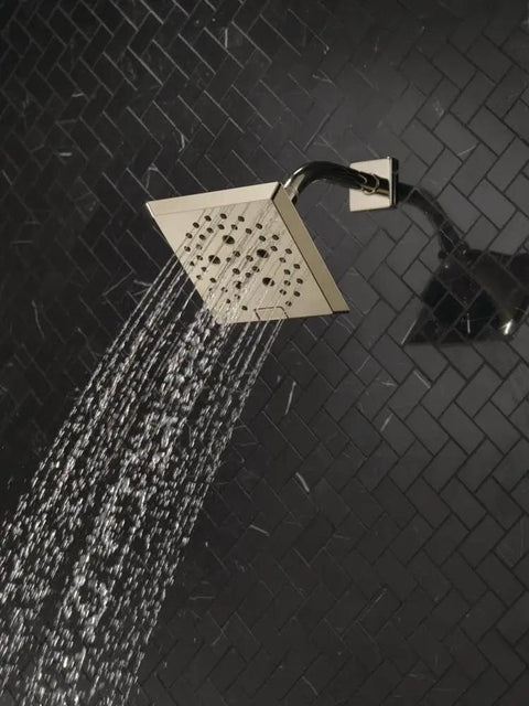Square Shower Head With H2Okinetic PowerDrench Spray Kickin 3x Coverage 5 Spray Settings Touch Clean 1.75 GPM Lumicoat Polished Nickel Finish Full Body Spray emitting water in bathroom