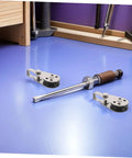 Stainless Steel Roller Wheel Pulleys Set 4 Pack Pro Grade Beefed Up Heavy Duty Cable Pulleys lying on a workbench