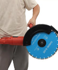 Badass 3000W 14 Inch Electric Concrete Saw With Built In Water Pump, holding diamond blade, ideal for industrial cutting.