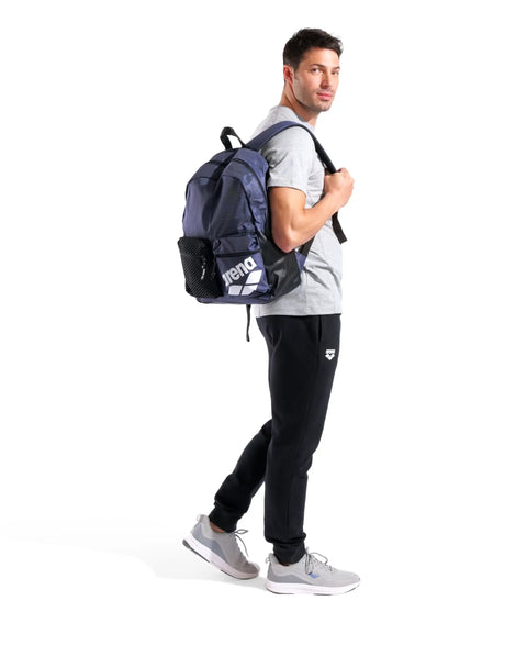Man wearing Do It All Swim And Sports Backpack 30L Navy Blue For Men And Women Multisport Daypack With Top Loading Main Compartment