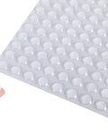 Premium Clear Silicone Cabinet Door Bumpers 200 Pack 0.4 Inch Round Self Adhesive Furniture Pads displayed on finger.
