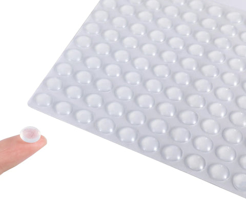 Premium Clear Silicone Cabinet Door Bumpers 200 Pack 0.4 Inch Round Self Adhesive Furniture Pads displayed on finger.