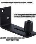 Close-up view of Two Pack Sliding Barn Door Floor Guides with Adjustable Rollers, showing black carbon steel construction and mounting.