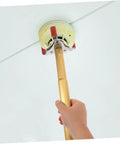 No Sweat Premium Smoke Sensor Removal Tool With Heavy Duty Claw Head Aluminum Body, hand gripping sensor puller.