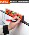 User using Pro Grade 12 Inch Magnetic Torpedo Level With Dead On Precision Green Acrylic Vials to mark a wall.