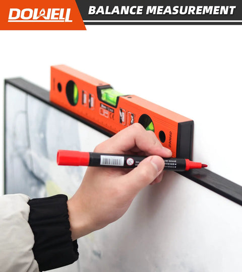 User using Pro Grade 12 Inch Magnetic Torpedo Level With Dead On Precision Green Acrylic Vials to mark a wall.